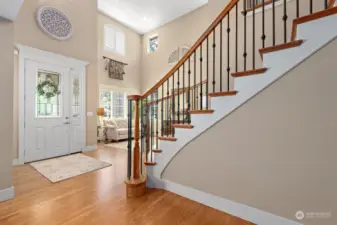 Grand Entry with soaring ceiling.  Gorgeous hardwood floors on the main level and entry staircase.