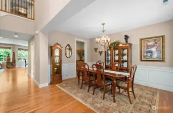 Formal dining room with custom wainscoting and gorgeous hardwood floors.