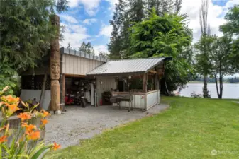 Outdoor kitchen area with attached covered storage space. Seller will leave a smoker, BBQ and prep station.