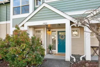 Covered porch space and plenty of guest parking along the tree lined street.