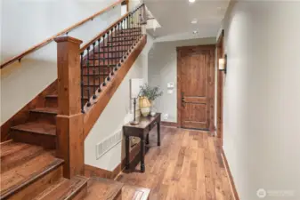 The end of the hall to the right is the large utility room. Straight is the garage, then to the left is 1 of 5 bathrooms. The guest bath was intentionally placed away from the main gathering area for added privacy.