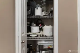 Another kitchen cabinet across from island.