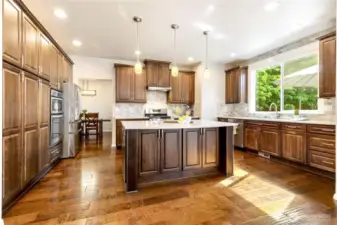 Custom wood cabinetry with ample storage and island seating!