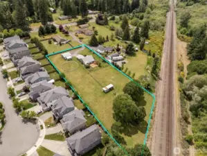 Quiet meets convenience. A green buffer and train tracks keep your backyard calm, while the friendly cul-de-sac neighborhood next door adds just the right amount of community.