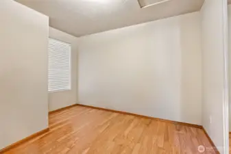 Light, bright, and laminate-floored, this bedroom keeps it simple in the best way. The wide slat blinds give you privacy when you want it and sunshine when you don’t. Guest room? Office? You decide.