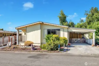 Level entry into the home at the utility room access door from the covered carport area.