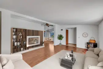 Formal living room area. Pellet stove in corner for those chilly fall and winter days. Easy care laminet flooring.   Room is virtually staged.