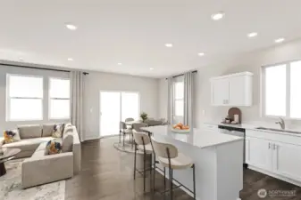 Open kitchen and family room concepts. Laminate flooring on the main level. Pictures are for representation only colors and options may vary.