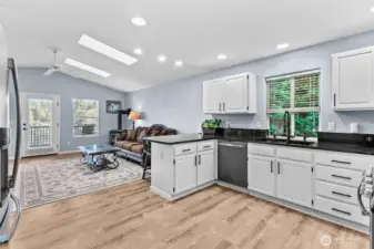 A look from the kitchen and into the living room with the lake beyond...