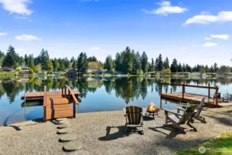 Imagine enjoying a campfire on the beach with friends or diving into the lake from your dock. Get your excersize as you paddle board or just relax and take it all in.