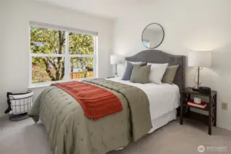 The second of three bedrooms located on the same floor. This one looks serenely over the gorgeous backyard.