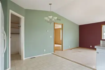 Dining area looking into laundry room and primary bedroom.