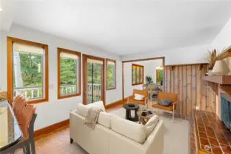 Great Sitting Area in Kitchen next to Wood Burning Fireplace and Door to Deck could be Sitting Area or Dining