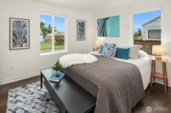 One of two main floor bedrooms with gorgeous floors and natural light.