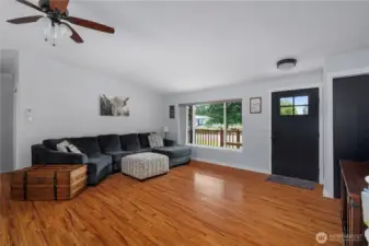Spacious and bright living room with laminate flooring. Lots of natural light.