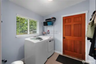 You can enter this nicely recently painted utility room from the kitchen or the garage.