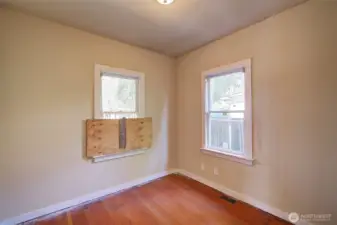 2nd main floor bedroom, also light filled. (needs a new window)