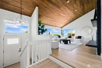 High wood ceilings and beautiful fireplace