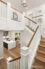 Stunning traditional staircase with handcrafted newel posts.