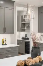 The Chef's Kitchen freatures custom oainted cabinets & quartz counters.