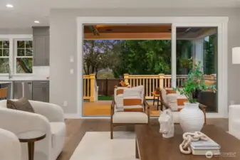 Great room opens to deck & side yard, ideal for entertaining.