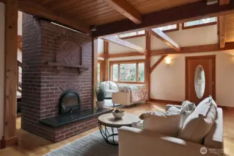 Curly up in front of the impressive fireplace, there is even an oven for cooking/baking on the backside. This is a Masonry Heater designed to provide all day heat throughout the house. It's also called a Russian Fireplace.