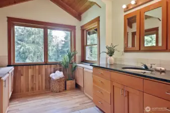 A bath with a view out over the lower gardens. Originally there was a large hot tub in the window nook. The plumbing remains in the floor.