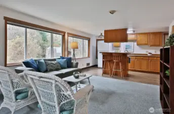 The light bright ADU has an open living, dining, and kitchenette.