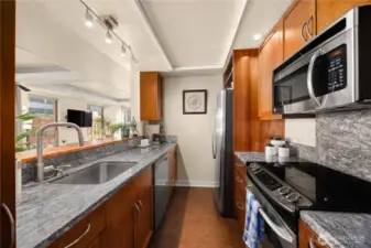 Easy flow updated kitchen, light and bright with bar top pass through.