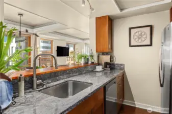 updated appliances, undermount sink, insta hot and custom cabinetry