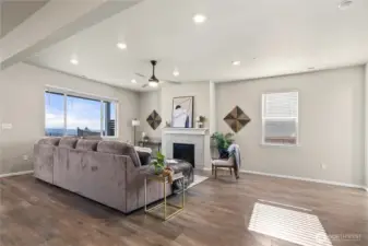 Spacious main living area with a comfortable layout, large windows, and a clean, open feel