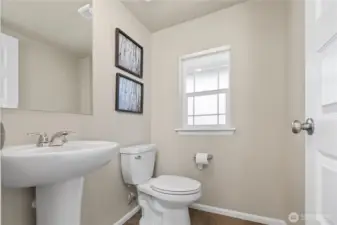 Main-level powder room convenient for entertaining
