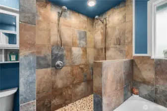 Spa-style 5-piece bath with jetted tub + dual shower.