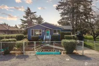 Front of the house is gravel with room to park 4-5 cars, with room to park 3 cars or RV in driveway.