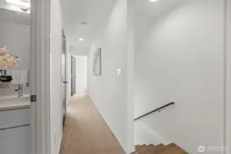 The second level also features a spacious, modern full guest bathroom designed with sleek, contemporary fixtures. The space is finished with durable ceramic tile flooring, maintaining the same high-quality and consistent design found throughout the rest of this 2019-built townhouse.