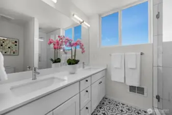 Gemini said  The primary ensuite boasts a spacious double-sink vanity, offering plenty of room for your morning routine. Featuring sleek modern cabinetry and light, bright designer finishes, this spa-like retreat perfectly mirrors the contemporary elegance found throughout the rest of the home.