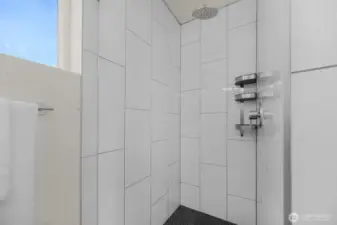 Gemini said  The primary ensuite boasts a spacious double-sink vanity, offering plenty of room for your morning routine. Featuring sleek modern cabinetry and light, bright designer finishes, this spa-like retreat perfectly mirrors the contemporary elegance found throughout the rest of the home.