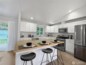 Bar seating on the large kitchen island.