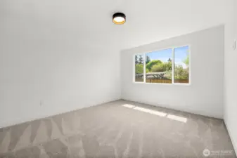 Primary suite shown unfurnished to appreciate the magnitude of the space.