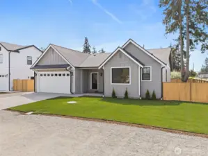 Beautiful privacy fence surrounds this home. Rich contrasting windows and lighting set the stage.