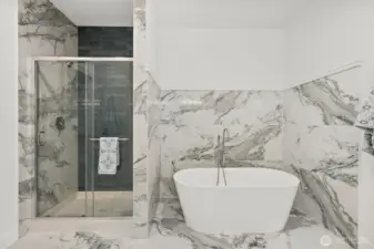 Relax in a hot bubble bath in this stylish freestanding tub.