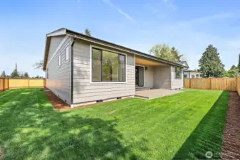 Wiggle your toes in the lush green grass in the backyard. 6 ft. fence optimizes privacy and separation.