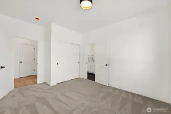 One of two guest bedrooms shown without furniture. Connecting Jack-n-Jill bathroom is genius!