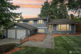 Front house with fresh landscaping.