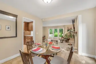 From the dining space, the open flow to the living area is apparent. This thoughtful layout allows for easy movement between spaces, ideal for gatherings and day-to-day living.