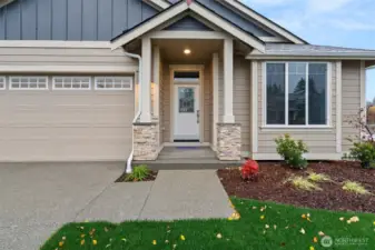 A stately front porch greets you as you enter the home.