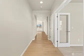 Office/Den or 3rd bedroom is off to the right with clear glass double doors.