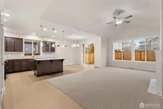 Spacious open concept living area that integrates kitchen & dining for living and entertaining.