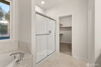 Primary bath comes standard with a separate walk-in shower with glass doors.