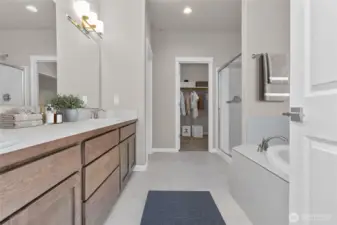 Virtually stage primary bathroom.